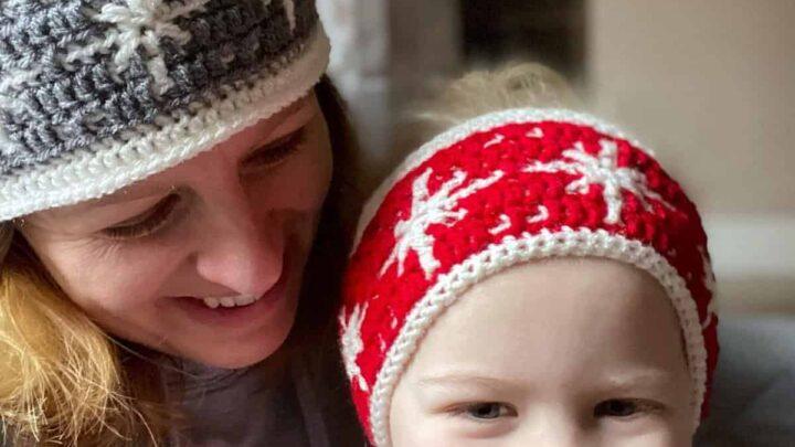 Mum and daughter wearing reversible crochet snowflake headband