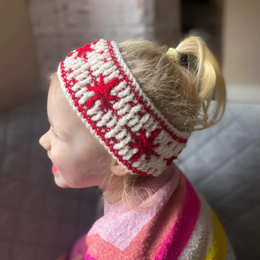 Girl wearing a snowflake headband
