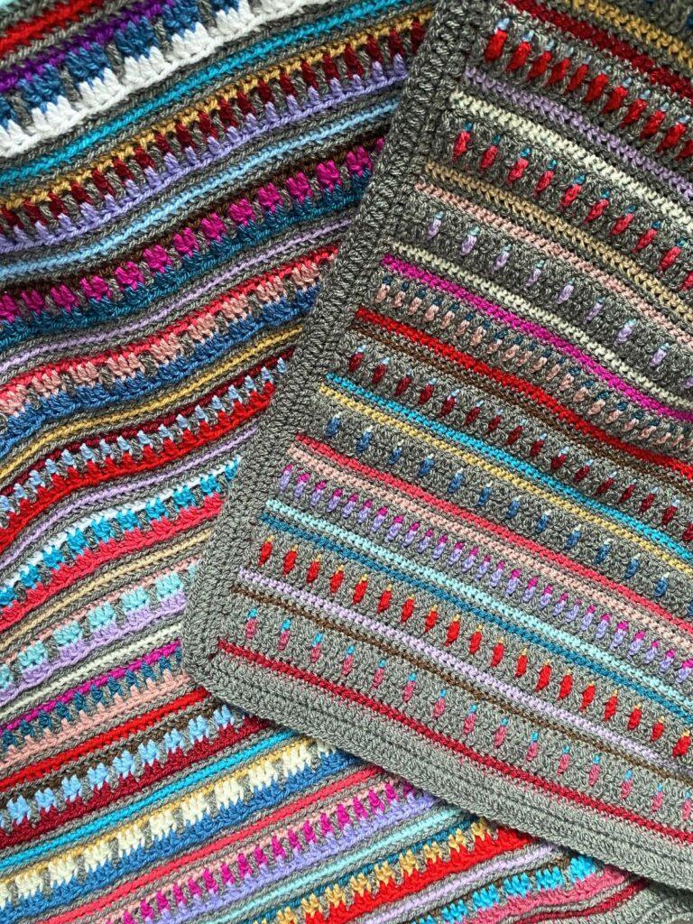 Close up of 2 sides of a mosaic crochet striped blanket