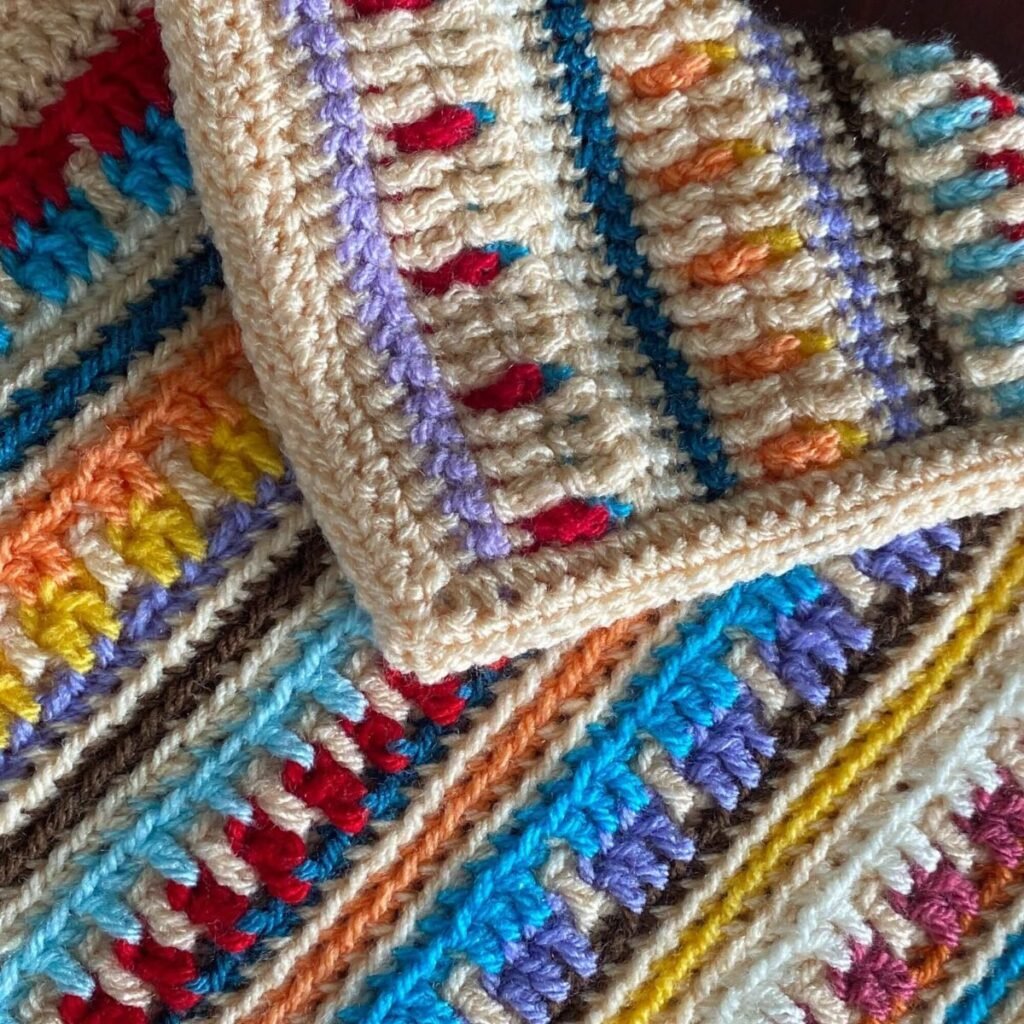 A close up of a crocheted fabric in reversible overlay mosaic crochet