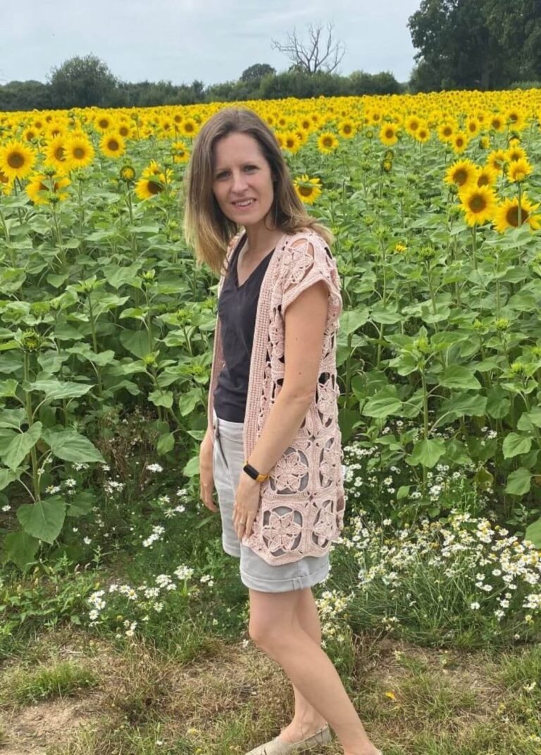 A lady wearing a lace crochet cardigan