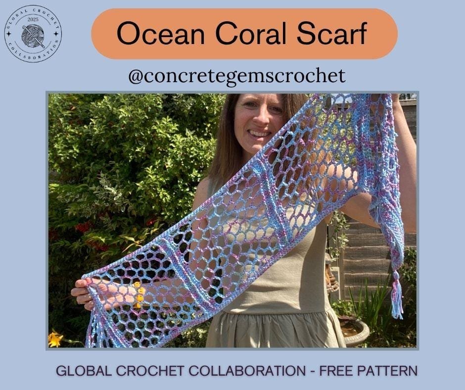 A lady holding up a lace crochet scarf