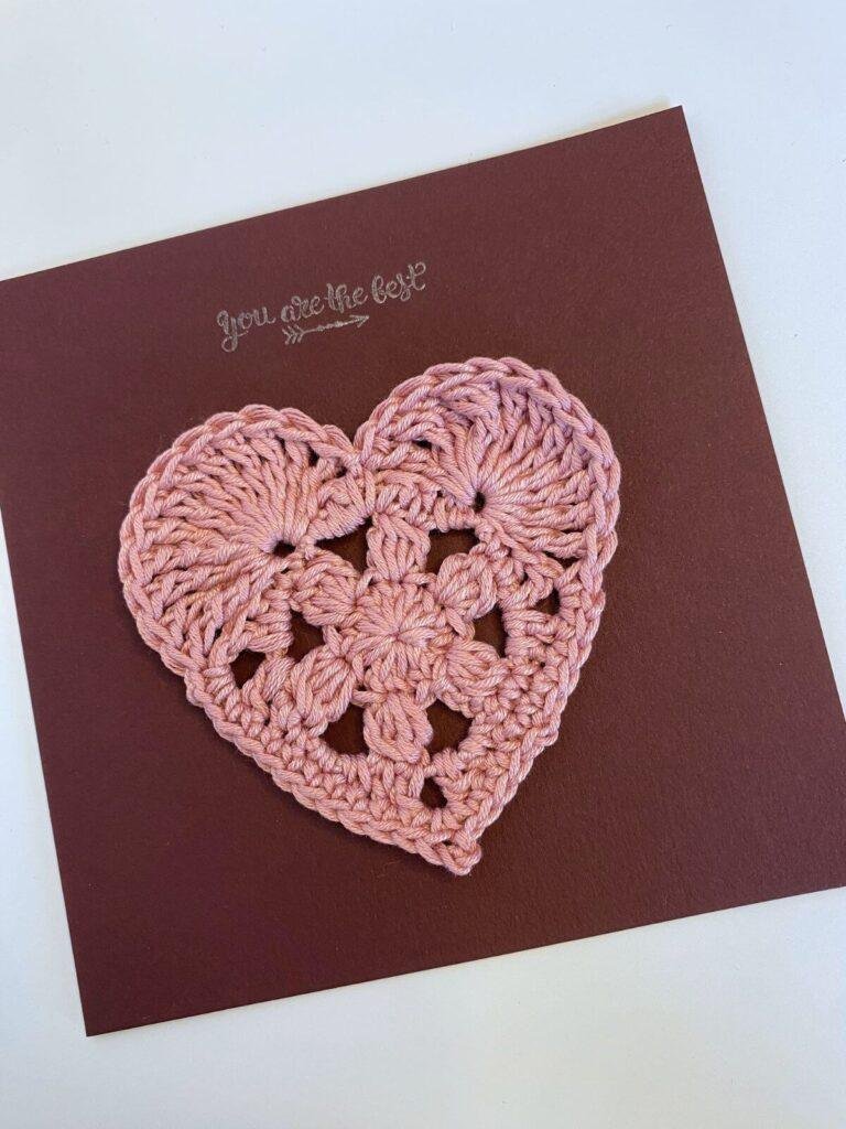 Pink crochet love heart on a burgundy card