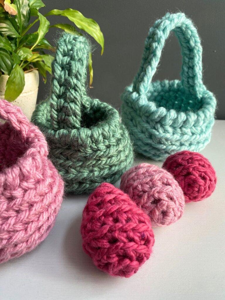 3 chunky crochet easter egg and 3 crochet easter baskets behind
