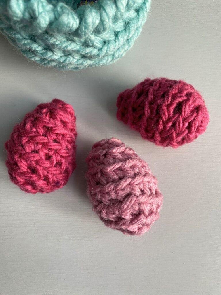 3 pink crochet eggs