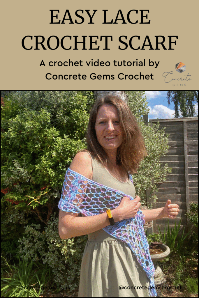 A pin image of a woman in a garden in a green dress with a blue lacy crochet shawl.