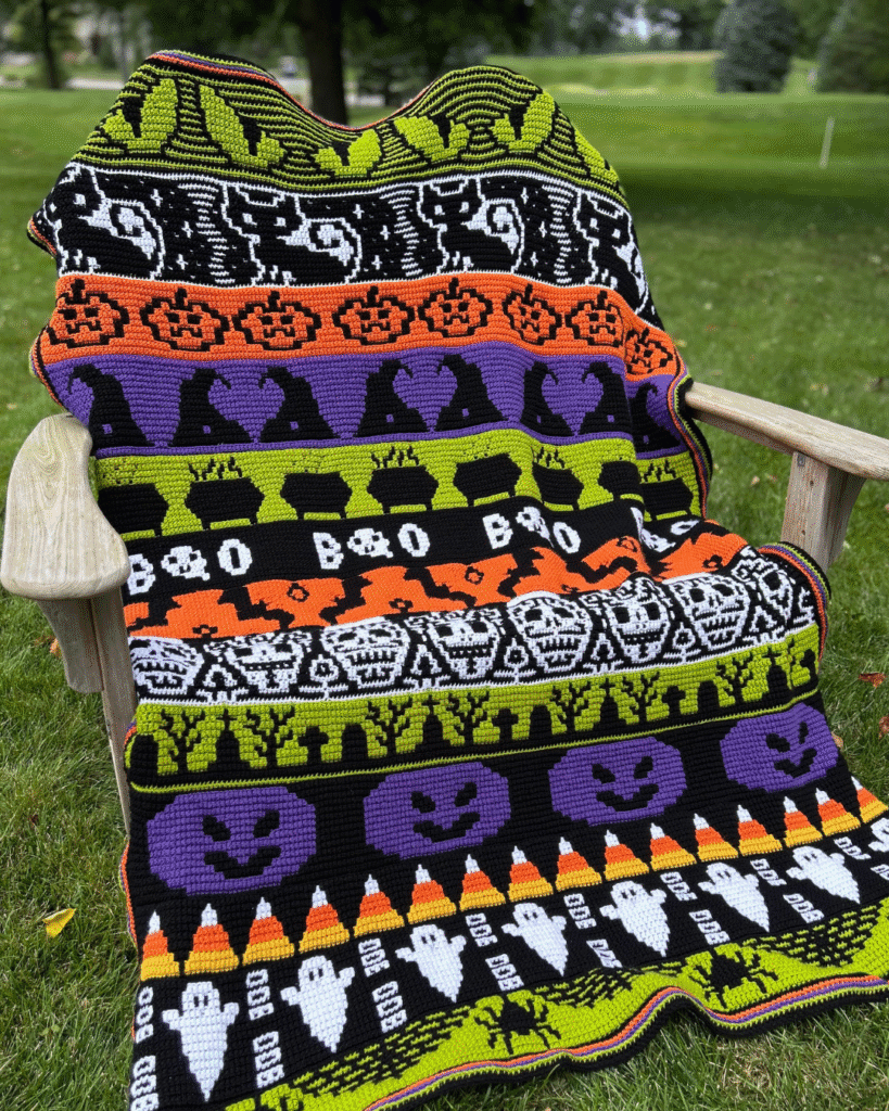 Halloween mosaic blanket featuring strips of witches, ghosts, boo, pumpkins etc