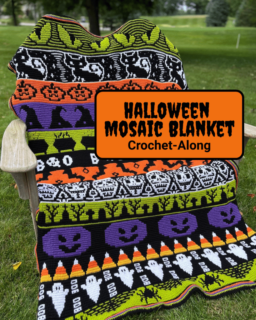 The halloween blanket in black, purple and green, featuring ghosts, pumpkins, spiders and more