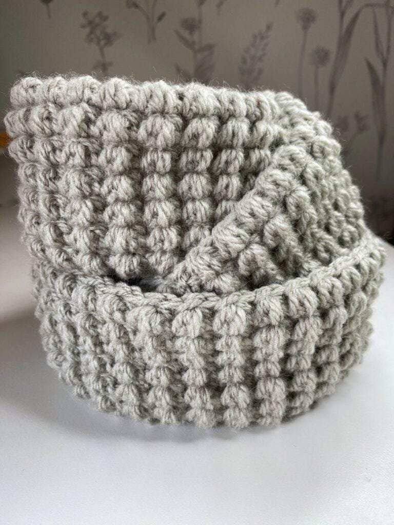 3 crochet baskets stacked on top of each other showcasing a beautiful texture