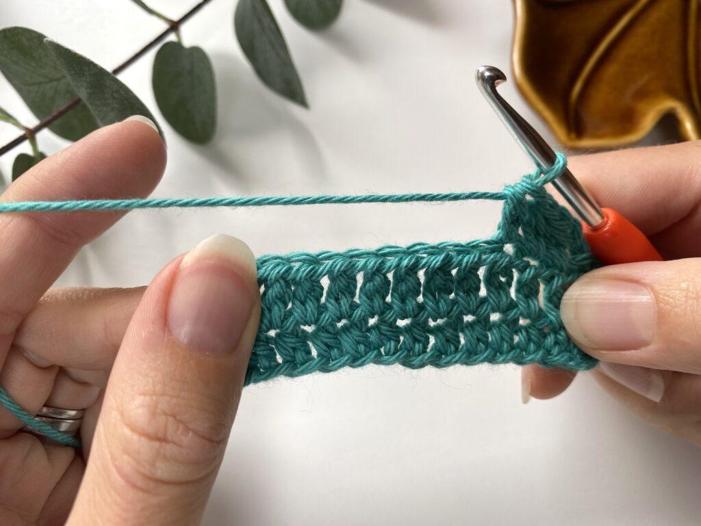 A close up of a sample of extended half double crochet stitches
