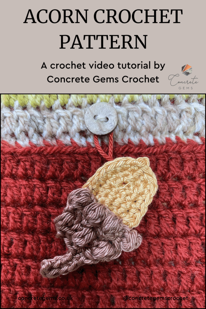 A crochet acorn is hanging on a red crochet background for a advent calendar with the words ACORN CROCHET PATTERN above