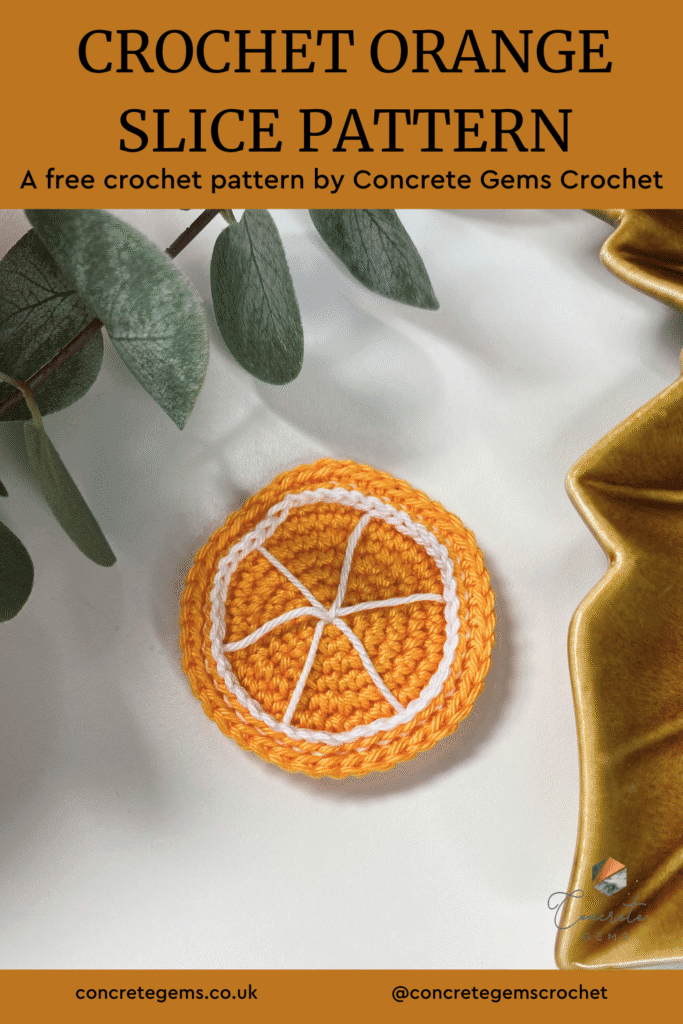A crochet orange slice pattern is shown on a white background with greenery and a brown dish around the edge and the words CROCHET ORANGE SLICE PATTERN above