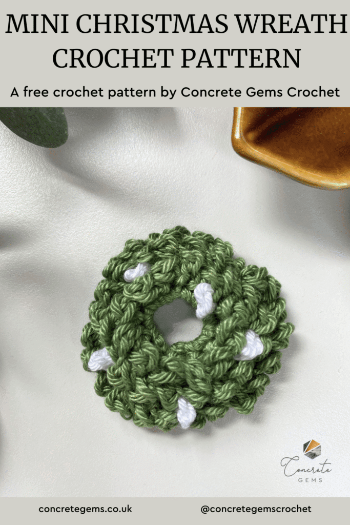 A mini Christmas wreath crochet pattern is written at the top and a photo of it is shown below in green with white berries