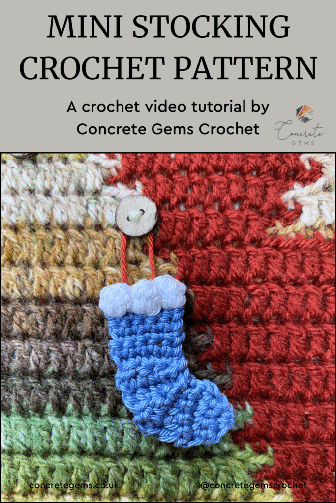 A mini blue crochet stocking ornament hangs on a button and a crochet Christmas tree and the words MINI STOCKING CROCHET PATTERN are above