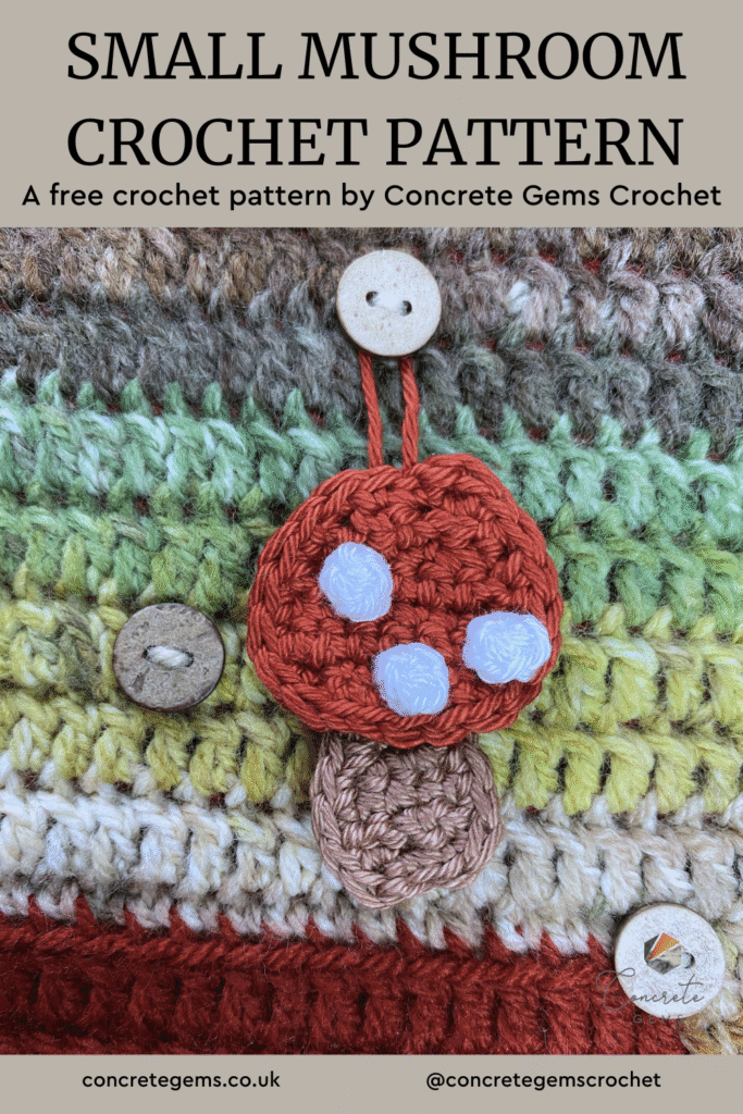 A crochet toadstool hangs on a button on a crochet advent calendar and the words SMALL MUSHROOM CROCHET PATTERN above