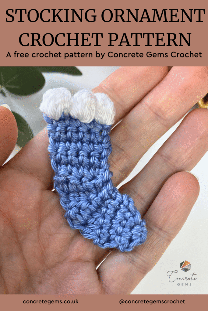 A mini blue crochet stocking with white edging is in the palm of a hand with the words STOCKING ORNAMENT CROCHET PATTERN above