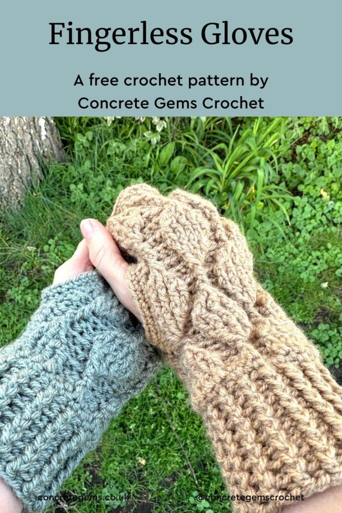 2 hands are grasping each other and both are wearing crochet fingerless gloves, one is beige and one is green but they have the same leaf motif along them. Grass is in the background
