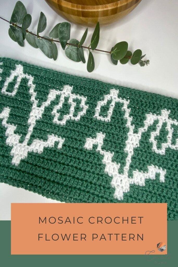 mosaic crochet flower pattern with a white crochet snowdrop and a green background