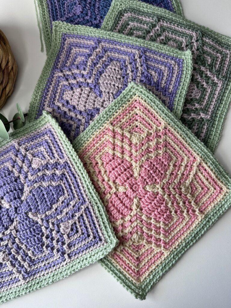 4 mosaic crochet squares with geometric floral motifs in different colours.