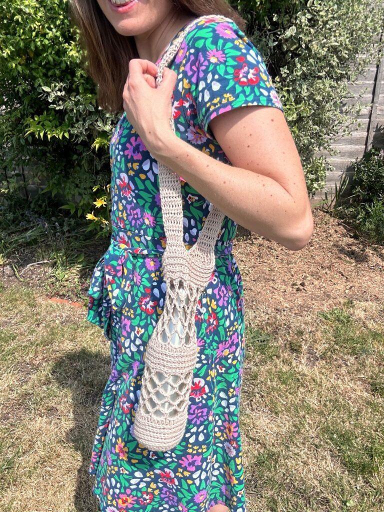 Free crochet water bottle holder pattern - Ocean Coral design in beige with adjustable strap