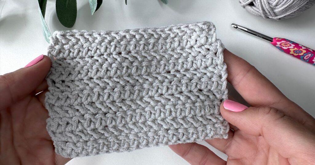 Herringbone half double crochet stitch swatch in grey yarn