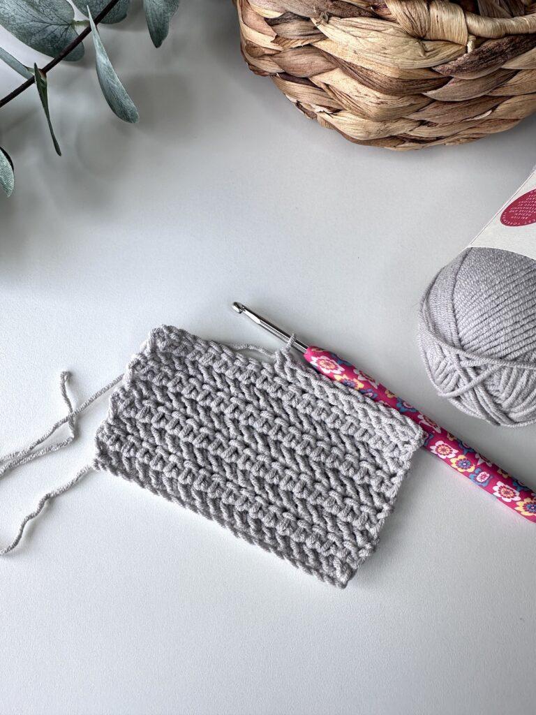 A swatch of crochet of the herringbone hdc stitch
