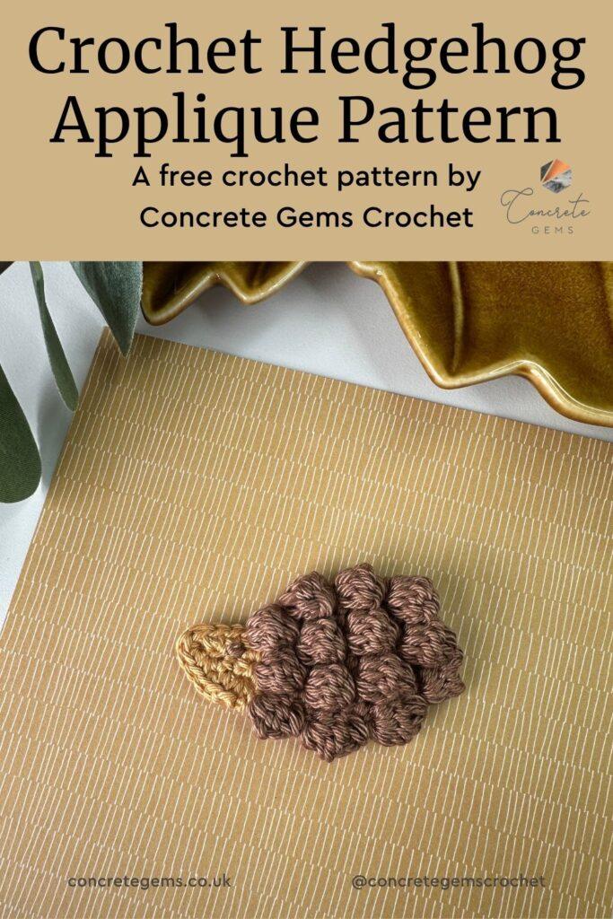 A crochet hedgehog applique in brown and topaz yarn on a brown background