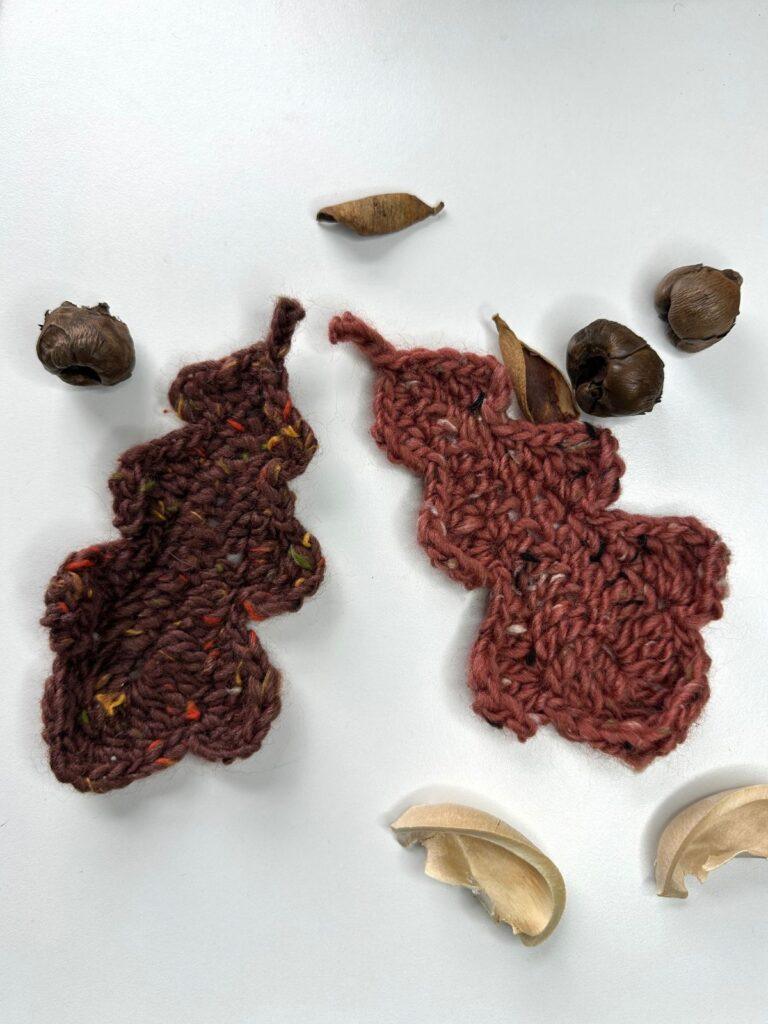 Crochet oak leaves in rust and brown tweed yarn with nuts around them